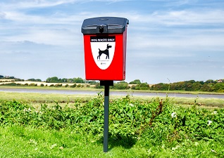 Fido™ 25 red dog waste bin in field