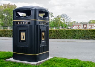 Glasdon Jubilee™ 240L Wheelie Bin Housing in black on outside area in front of library