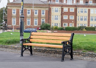 Lowther™ outdoor seating in public area with light wood effect slats
