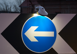 Lumino City™ LED Downlighter illuminating light for blue sign with arrow