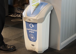 Nexus® 30 Confidential Paper Recycling Bin with pastel blue graphics and slot aperture with person inserting document