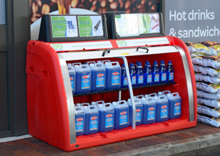 Orion™ Storage Unit in red showcasing car screen wash for sale in front of shop