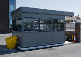 Warrior™ contemporary modular steel building in dark grey with windows