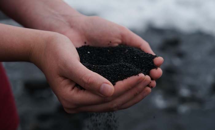 A hand holding soil