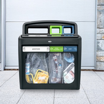A multi-stream recycling station with three waste streams in a public place that is transparent for easy viewing of the contents of the bins
