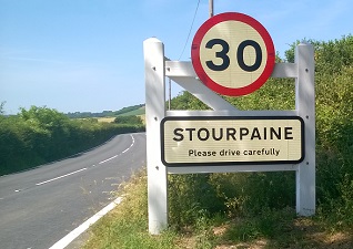 Glasdon Gateway as a welcome sign on the roadside with speed limit change and drive carefully warning