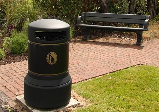 Mini Plaza Litter Bin fixed to a concrete base