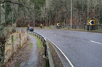 Several Apex Chevron Signs along the side of a country road