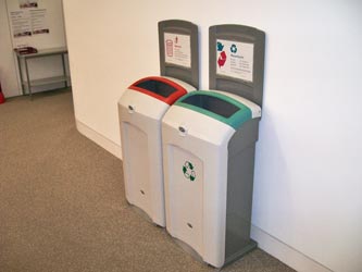 Nexus 100 recycling bins against a wall in an office