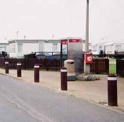 Buffer bollards placed along the pavement with retro-reflective bands