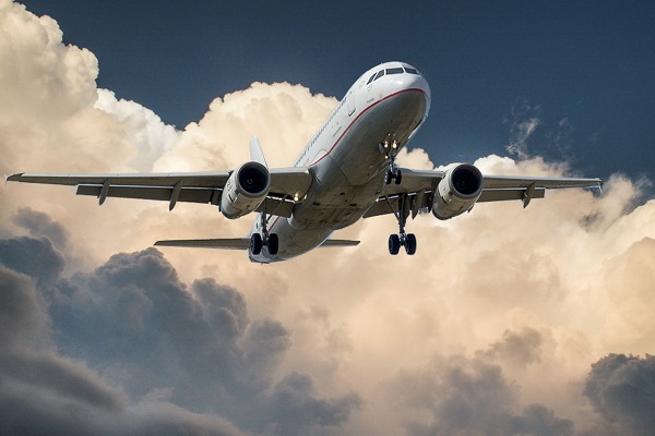 A commercial plane flying through the sky