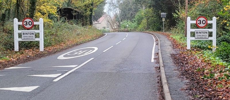 Image of two village gateway signs with 30 and 40 speed limit.