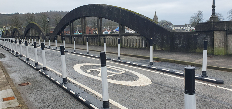 finished construction works on Kirkcudbright Bridge with Endurokerb cycle lane defenders installed in the road to narrow the carriageway