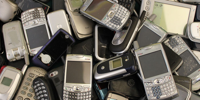 A pile of used mobile phones