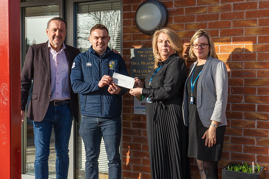 Glasdon handing over cheque to Fylde Rugby Club representatives