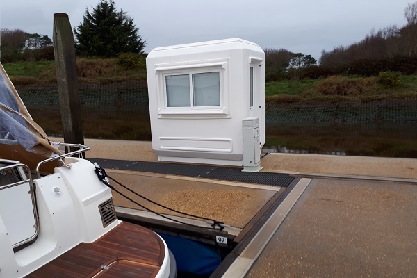 A Genesis Kiosk beside a harbour
