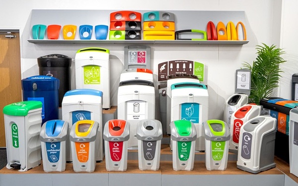 a selection of Glasdon recycling bins lined up together in a showroom