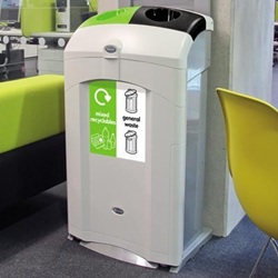 nexus 100 recycling bin with dual white general waste and green mixed recyclables graphics in a seating area