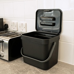 nexus 7l food waste caddy on a kitchen countertop next to a toaster