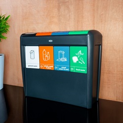 nexus evolution recycling bin with 4 simpler recycling waste streams and graphics in a hallway