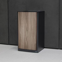 nexus style 85 recycling bin with a natural wood-effect finish in a commercial building