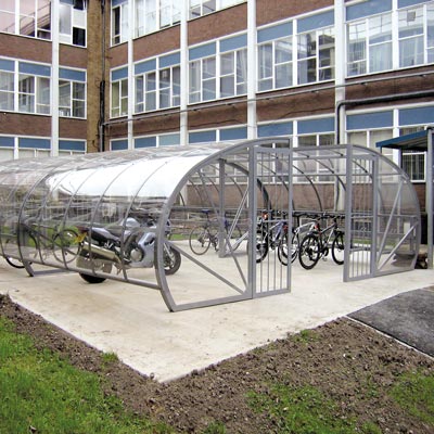 a transparent cycle compound with bicycle and bicycle racks inside