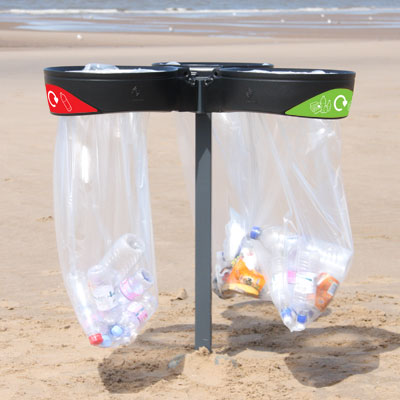 orbis transparent triple sack holder bin on a public beach