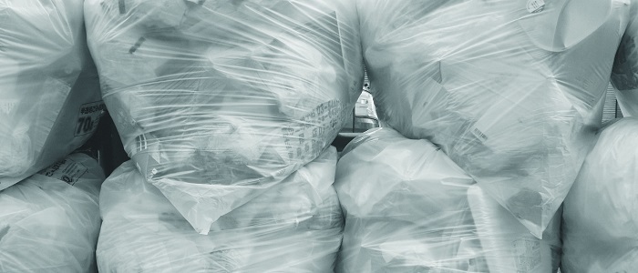 piled up bags filled with waste
