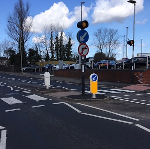 Two Socketed Signmaster Bollards foxed to a island near a zebra crossing