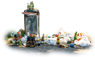 piles of litter piling up next to an overflowing litter bin