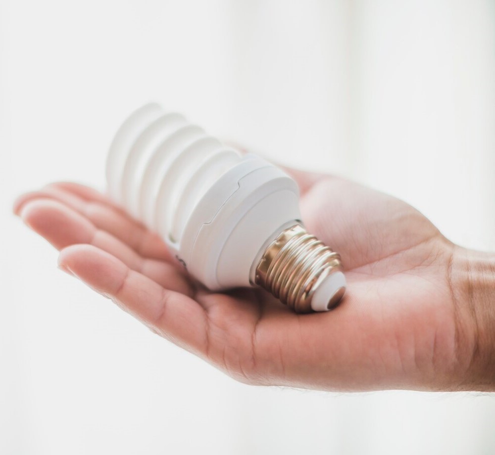 Hand holding cfl light