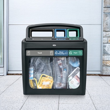 A multi-stream recycling station with three waste streams in a public place that is transparent for easy viewing of the contents of the bins
